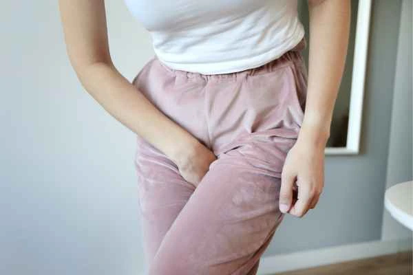 woman running for the toilet because of urinary incontinence Greater London (Barnet)
